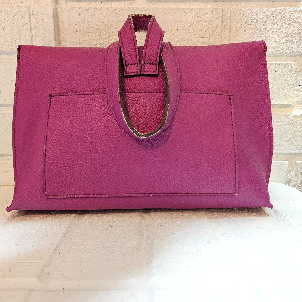 Vibrant Magenta Clutch with Unique Circular Handle